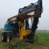 Herder draaikiepkop op graafmachine