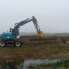 Herder draaikiepkop op graafmachine