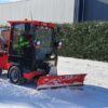 Nimos Posi-Trac met sneeuwschuif aan het werk
