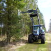 Aanbouwframe Puma 2803 met zaagunit Greentec op New Holland tractor